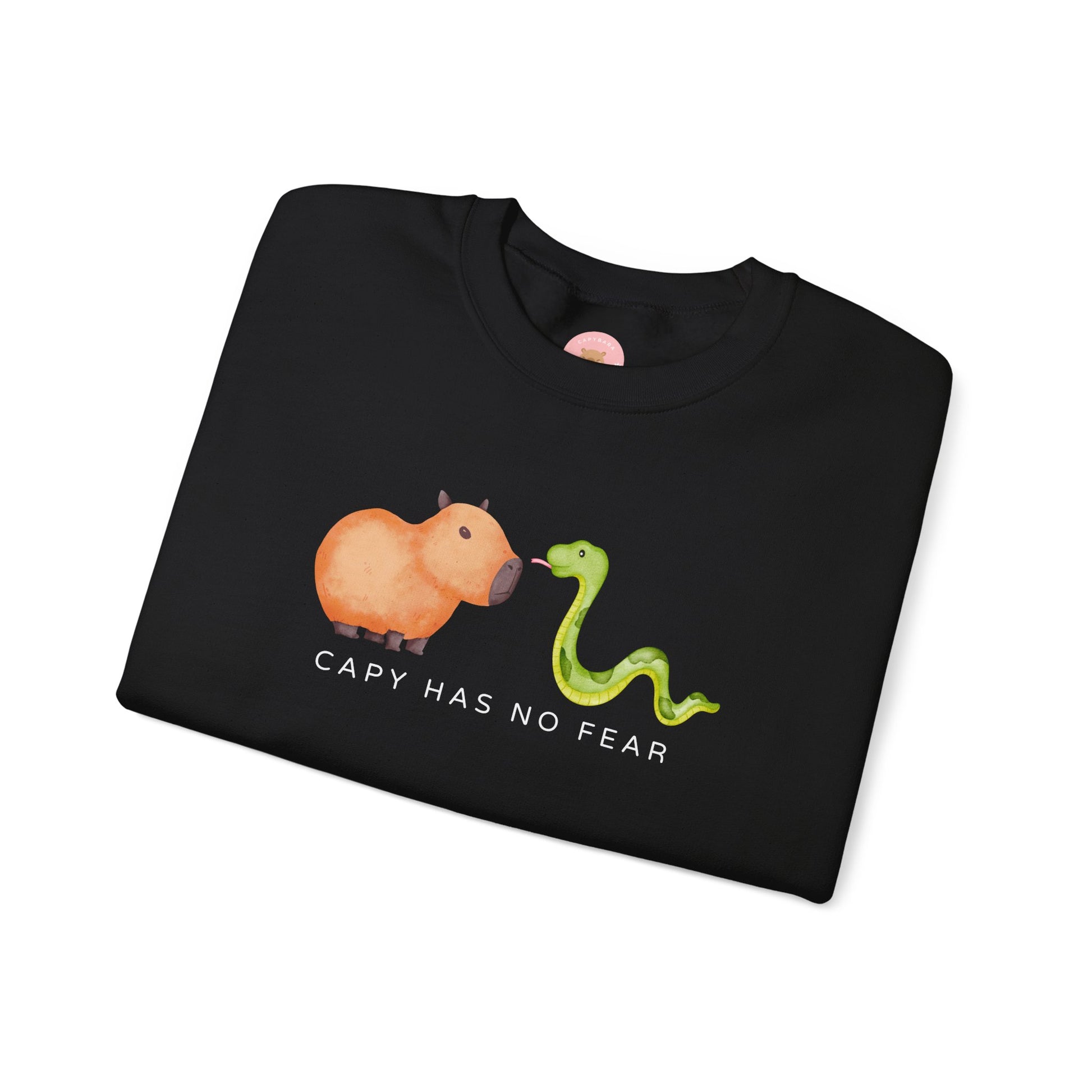 CNY Capybara clothes, Year of the Snake in style with our 'Capy has no fear' Crewneck Sweatshirt! Featuring a bold graphic of a fearless capybara facing a snake, this design is a humorous and symbolic nod to the Chinese New Year. Show off your courage and charm while staying cozy—perfect for family gatherings and festive celebrations!