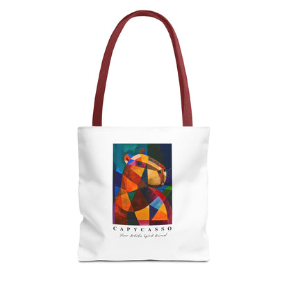 Capybara tote bag featuring a painting inspired by Pablo Picasso, with abstract forms and geometric shapes. 5 handle colours. Perfect for art lovers and capybara enthusiasts, this tote bag adds a touch of artistic flair to your everyday errands. Great for carrying books, groceries, or daily essentials. Ideal for art enthusiasts, animal lovers, and those looking to add a pop of creativity to their style. Perfect for gifting on birthdays, holidays, or as a treat for yourself.