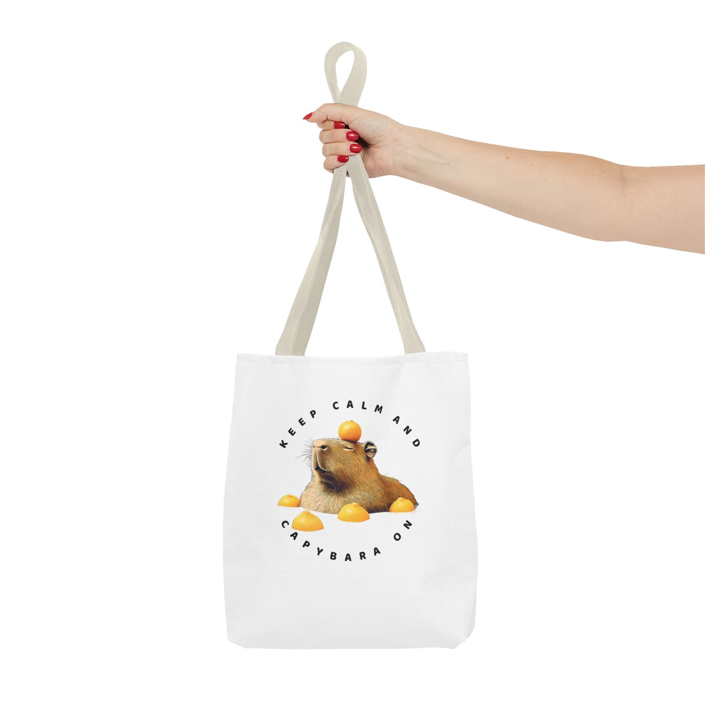 Keep Calm and Capybara On tote bag. Eco-Friendly Tote Bag. Featuring a relaxing capybara enjoying a yuzu bath. It is great for everyday use, carrying groceries or as a fun gift. Made with 100% polyester, a medium-weight fabric that is highly durable.