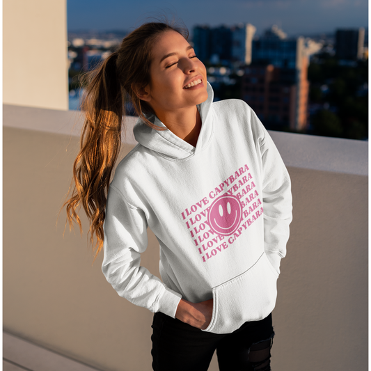 I Love Capybara hooded sweatshirt. This hoodies has a smiley face and is perfect for those who love calm vibes. Soft and comfy, it's an ideal choice for capybara lovers looking for a peaceful, stylish addition to their wardrobe.
